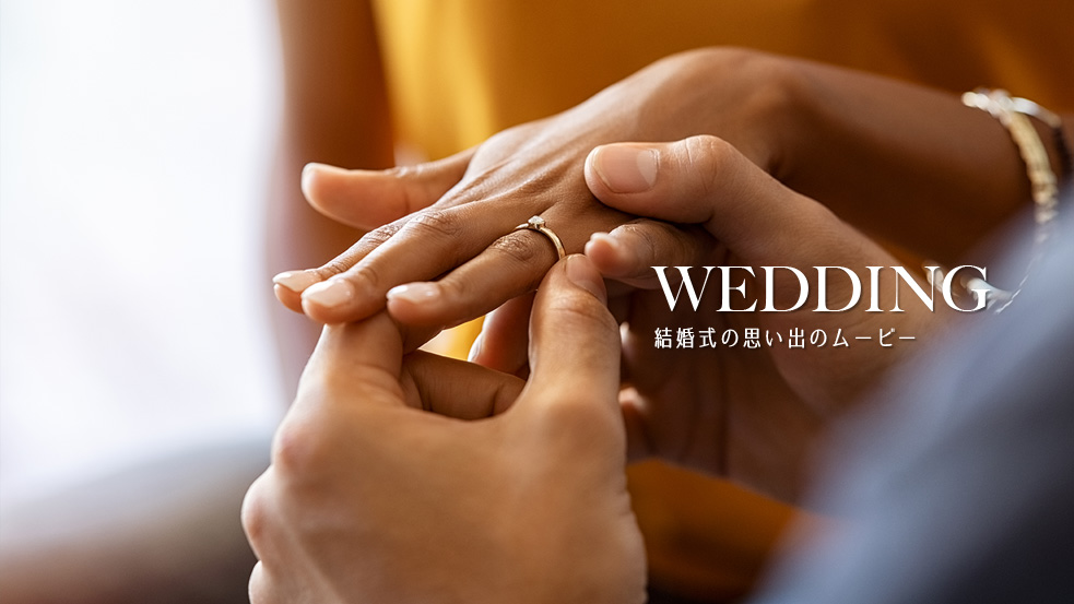 wedding 女性に結婚指輪をはめる男性の手